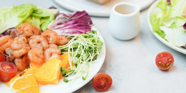 Shrimp salad with fresh vegetables looks delicious